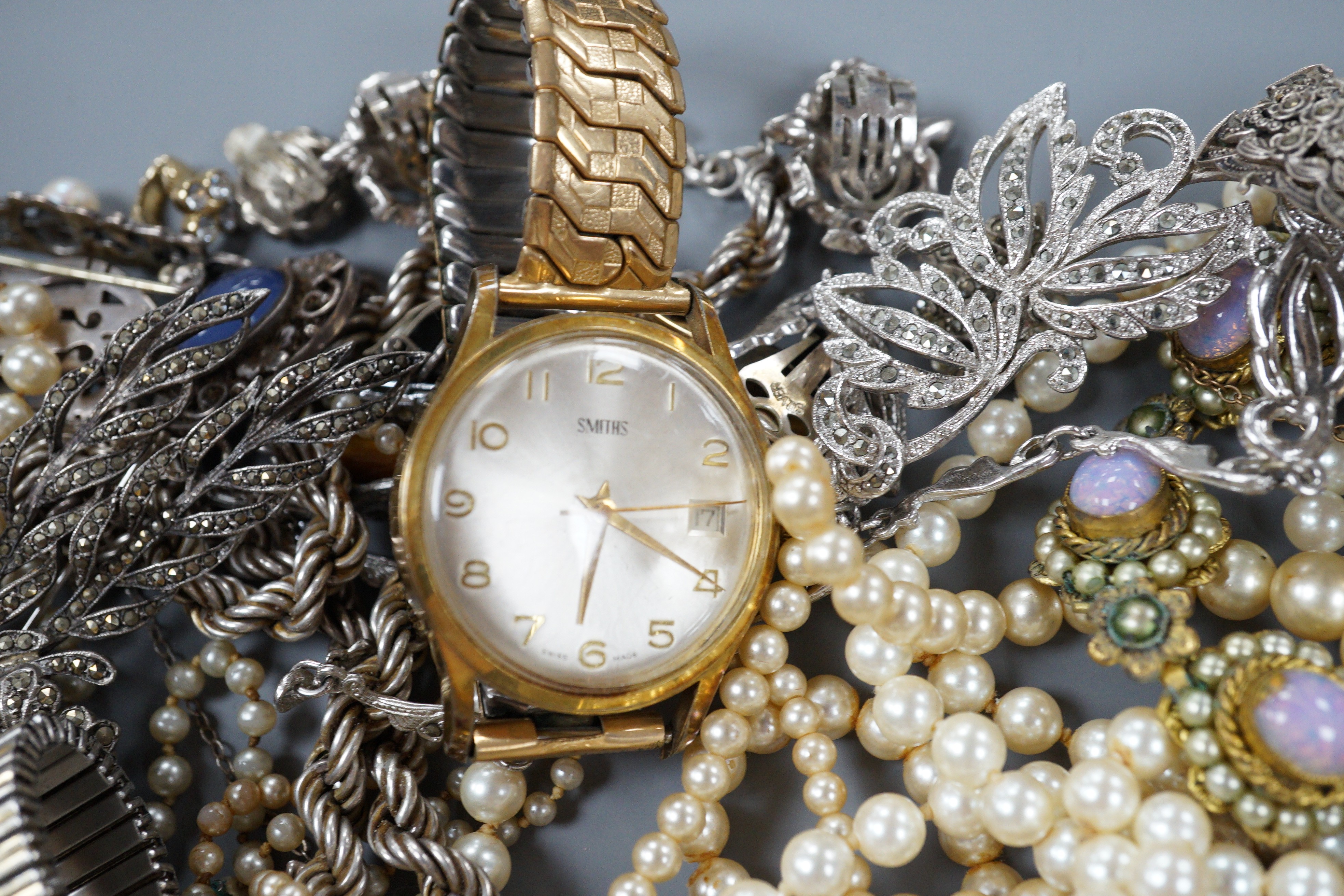A quantity of assorted costume jewellery, including marcasite and three gentleman's wrist watches including a 9ct Record.